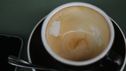Coffee latte close up on rustic wood table