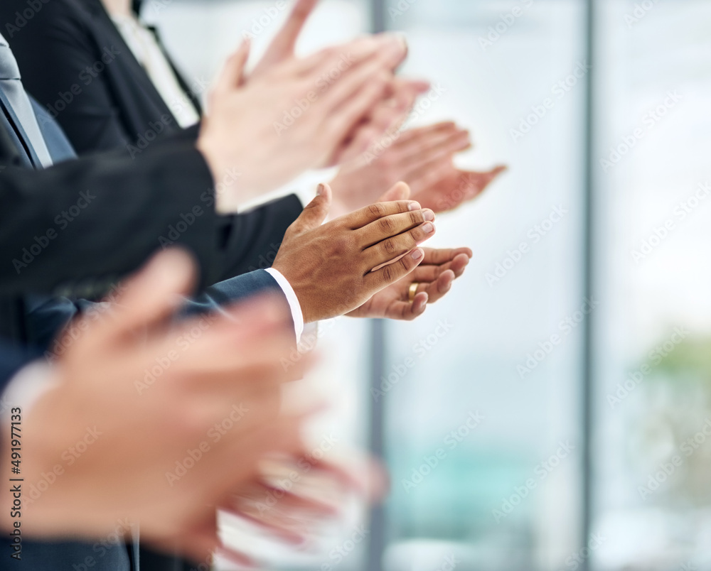 Poster Applauding a masterful presentation. Closeup shot of a group of executives clapping while standing in a row in an office.