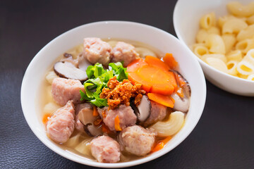 Macaroni soup with pork and carrot - delicious and healthy food concept
