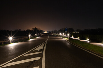 Street illuminated at night on the lakes near the center of Mantua