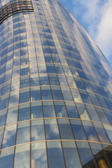Fototapeta premium Modern real estate glass facade tower. Architecture details.