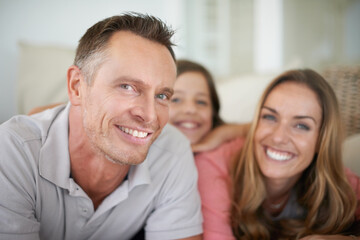 What more could you ask for. A happy family spending an afternoon relaxing on a couch at home.