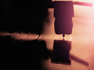 Record player needle on a record
