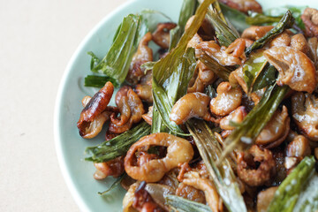 Crispy fried intestines and herbs on dish. Concept : Weird food. Delicious menu in Thailand. Best to eat with beer or eat as appetizer.                    