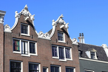 Fototapeta na wymiar Amsterdam Sint Antoniesluis Street House Facades with Bell Gables Close Up, Netherlands