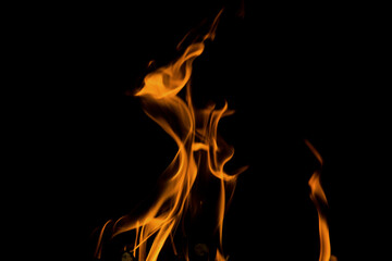 Fototapeta premium Close up burning flames on black background for graphic design or wallpaper