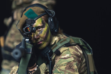 Courageous click pro soldier passionately aiming a rifle . High quality photo