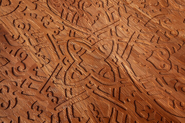 Wooden background or texture with carving patterns