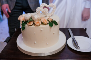 Beautiful wedding cake decorated with flowers, cake close up and blur background