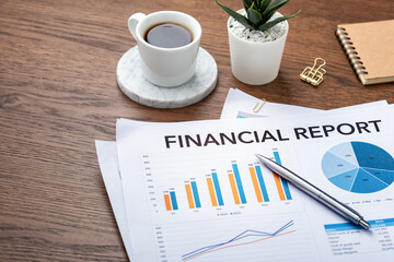 Financial graph chart report on wood table background