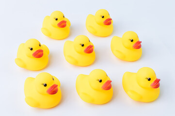 Group of toy ducks standing together. Teamwork and togetherness concept.
