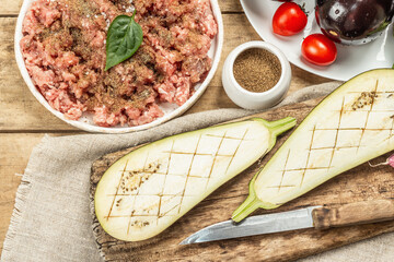 Stuffed eggplant ready to bake with ground meat, vegetables, and spices