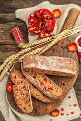 Whole grain bread with cranberry for holidays. Fresh homemade bakery, dry spikelets