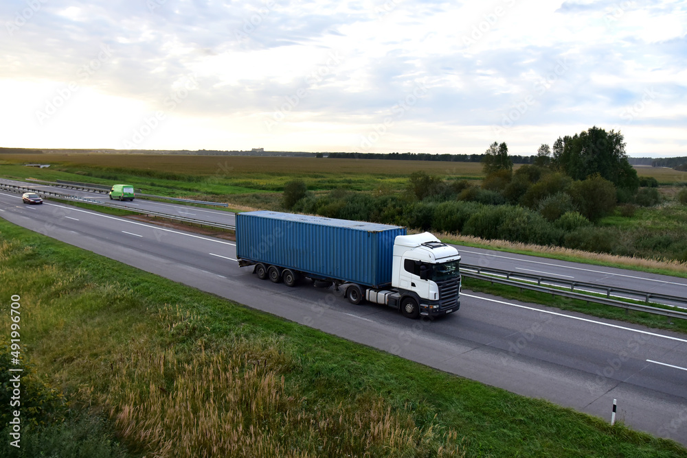 Wall mural semi truck transport the shipping container on highway. shipping containers delivery, maritime servi