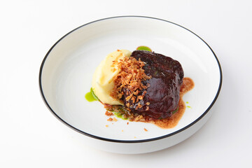 Beef cheeks with mashed potatoes. Hearty food. Meat food. Photo on a white background for the menu.Flat lay.Top view.Copy space.Isolated object.Flat lay.