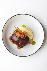 Beef cheeks with mashed potatoes. Hearty food. Meat food. Photo on a white background for the menu.Vertical photo.Flat lay.Top view.Copy space.Isolated object.Flat lay.