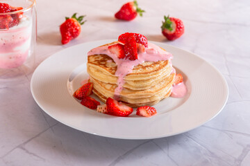 Strawberry pancakes on a white background.