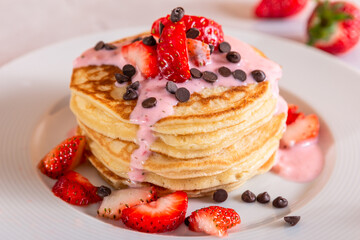 Strawberry pancakes on a white background.