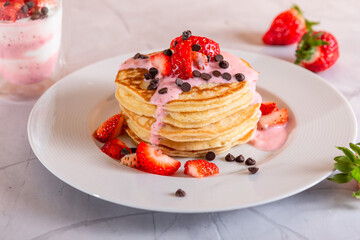 Strawberry pancakes on a white background.