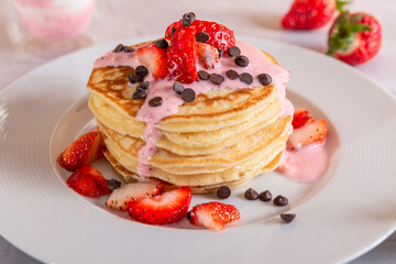 Strawberry pancakes on a white background.