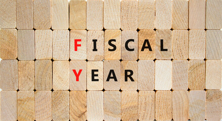 FY Fiscal year symbol. Concept words FY Fiscal year on wooden blocks on a beautiful wooden background. Business and FY fiscal year concept.