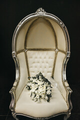 wedding bouquet on a beautiful chair. Armchair and bouquet.