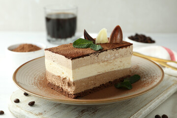 Concept of tasty dessert with Tiramisu cake, close up
