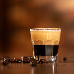 tasty coffee shot on wooden bar table square frame