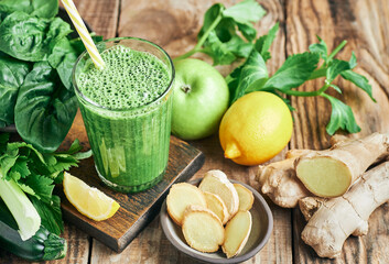 Fresh green vegan detox smoothie with ginger. Fresh healthy ginger green vegetables smoothie served...