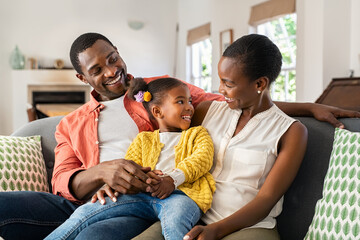 Cheerful african american family having fun at home