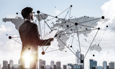 Concept of business success and control with confident boss against cityscape background