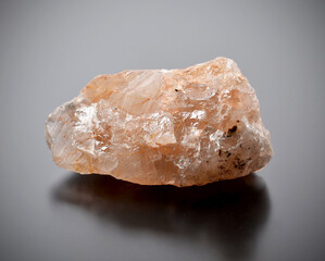 Raw rutile quartz on a dark background