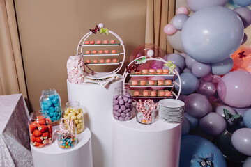 Luxury candy bar.Table with different sweets and cupcakes at a children's party