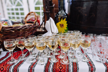 Wineglasses with tinctures on the Ukrainian buffet table.