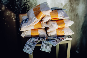 Cocaine and money. Close up view of party decorations and dollars at workplace in office. The drug...