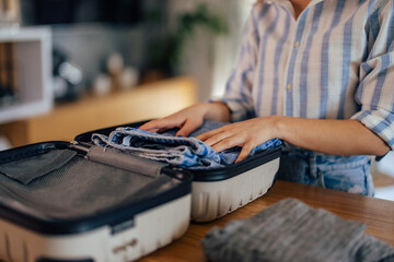 Close up of a female packing something into the mini coffer.