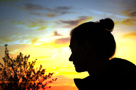 woman head silhouette at sunset mindfulness and meditation concept