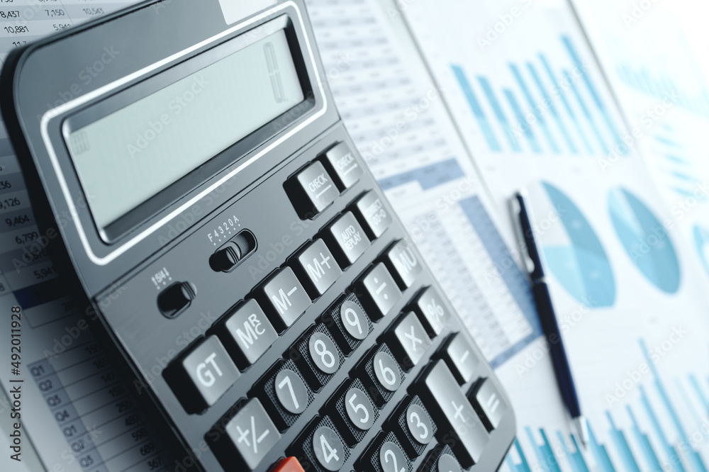Aufkleber Calculator and reports. Many graphs and figures. Financial analysis and management concept.