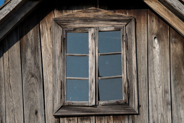 Obraz na płótnie Canvas Sunja, Croatia, April 20,2021 : Rustic style aged window at rural home wall.