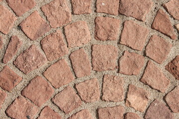 Close up of a red cobblestone walkway