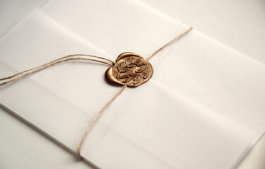 Fototapeta premium White envelope with a seal. Light background