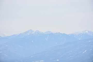 Fototapeta na wymiar Snowy mountain seen from Kurayama Plateau