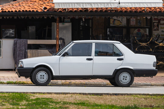 Side, Turkey &ndash; February 20 2022:  white Tofas Dogan parked on the street on a warm day