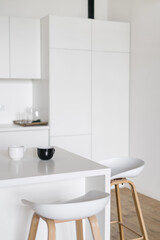 Fototapeta na wymiar Scandinavian styled kitchen interior design in white tones