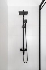 White shower zone with stylish black rain head