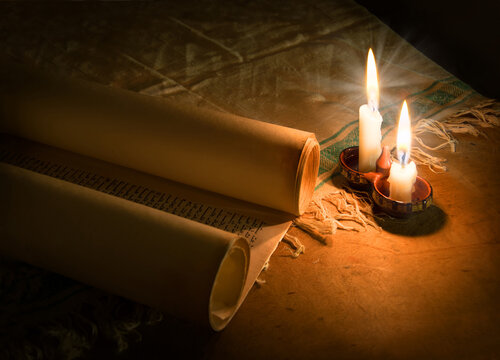 Ancient scroll lit by candlelight