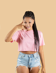 Young beautiful afro american woman wearing casual sweater over isolated beige background making...