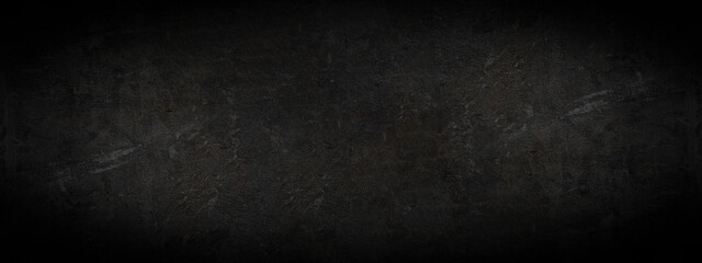 Black anthracite dark gray grey grunge old aged retro vintage stone concrete cement blackboard chalkboard wall floor texture, with cracks - Abstract background banner panorama pattern design template
