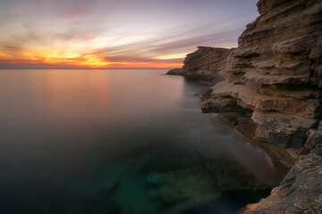 Fototapeta na wymiar Punta Galera sunset with red sky , Ibiza