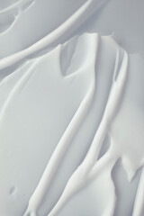 Cosmetic cream milk texture white colored smudge background	